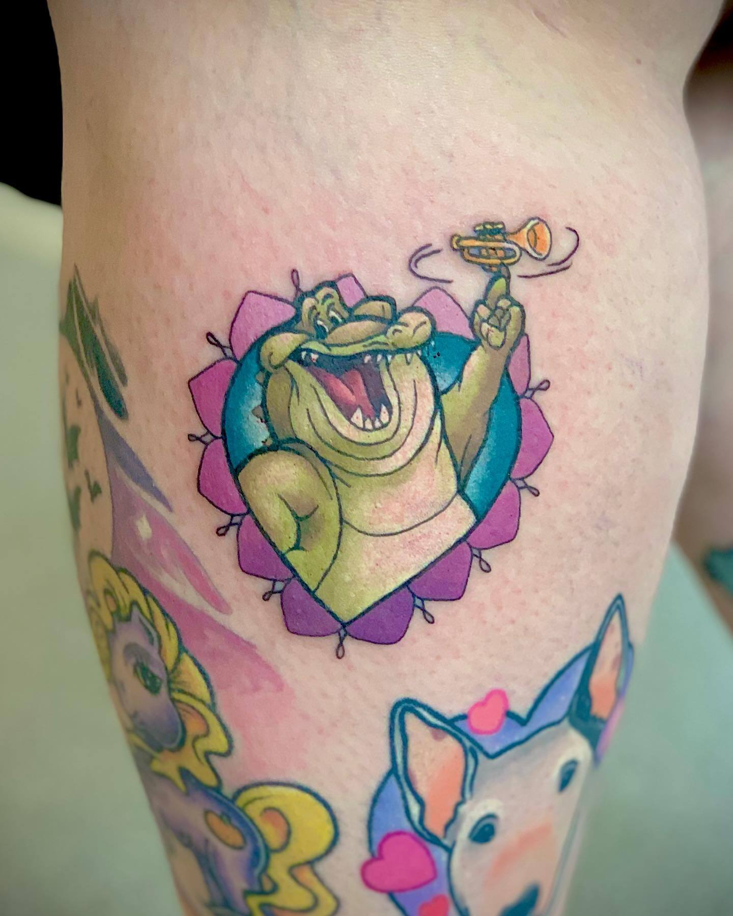 princess and the frog back of the leg tattoo