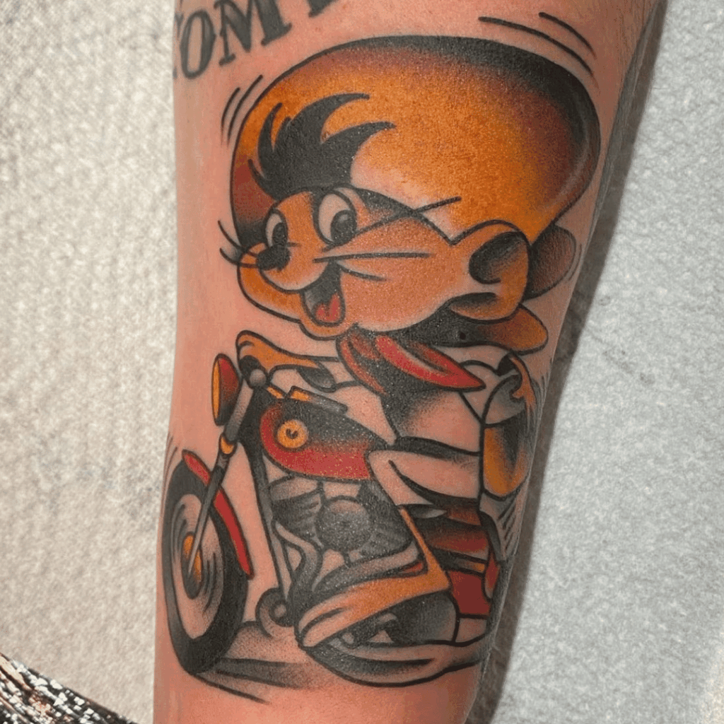 Speedy Gonzales running-pose tattoo on the lower leg
