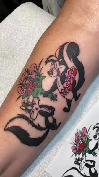 Vertical Pepé Le Pew forearm tattoo idea in full color