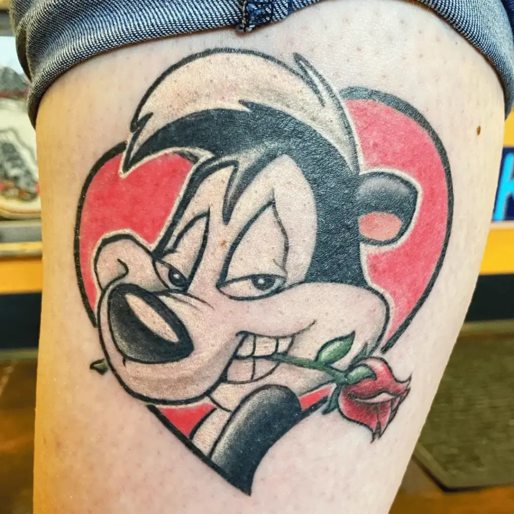 Pepé Le Pew tattoo positioned on the inner calf