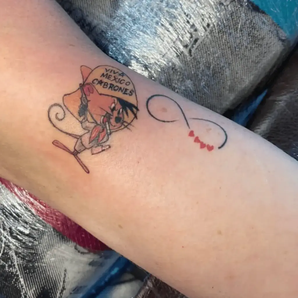 Minimal Speedy Gonzales forearm tattoo in a standing pose