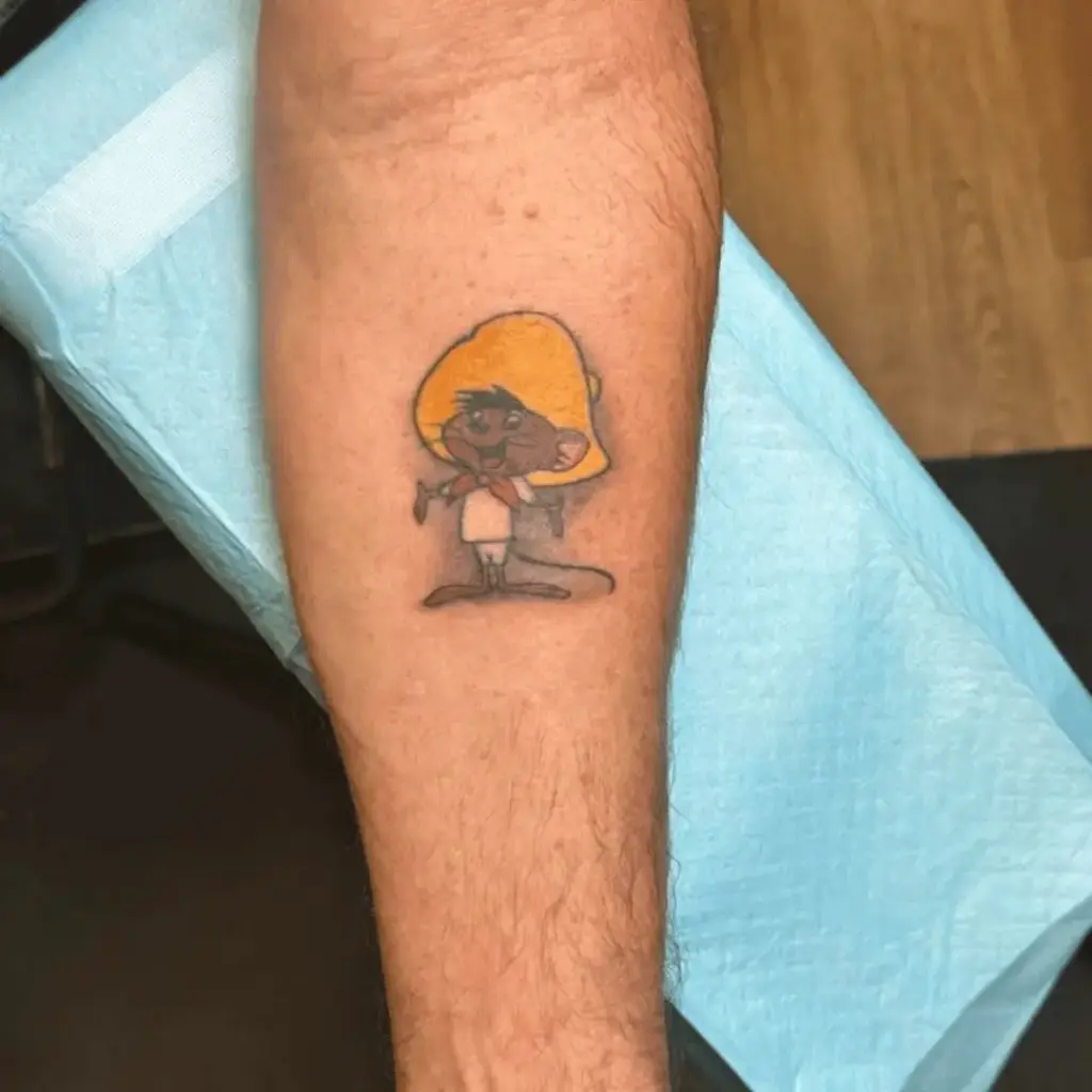 Small Speedy Gonzales tattoo on the inner forearm