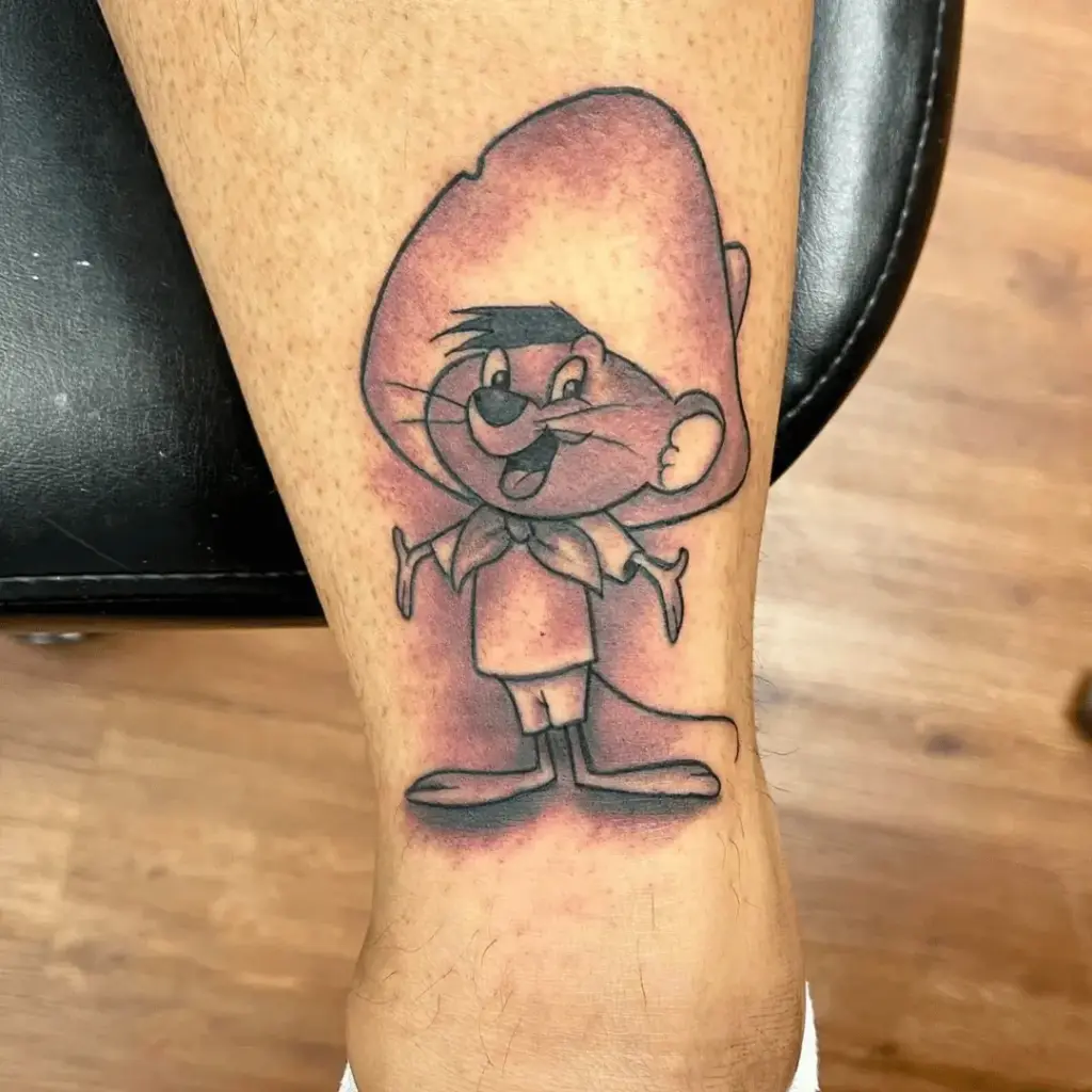 Bright Speedy Gonzales cartoon tattoo on the leg
