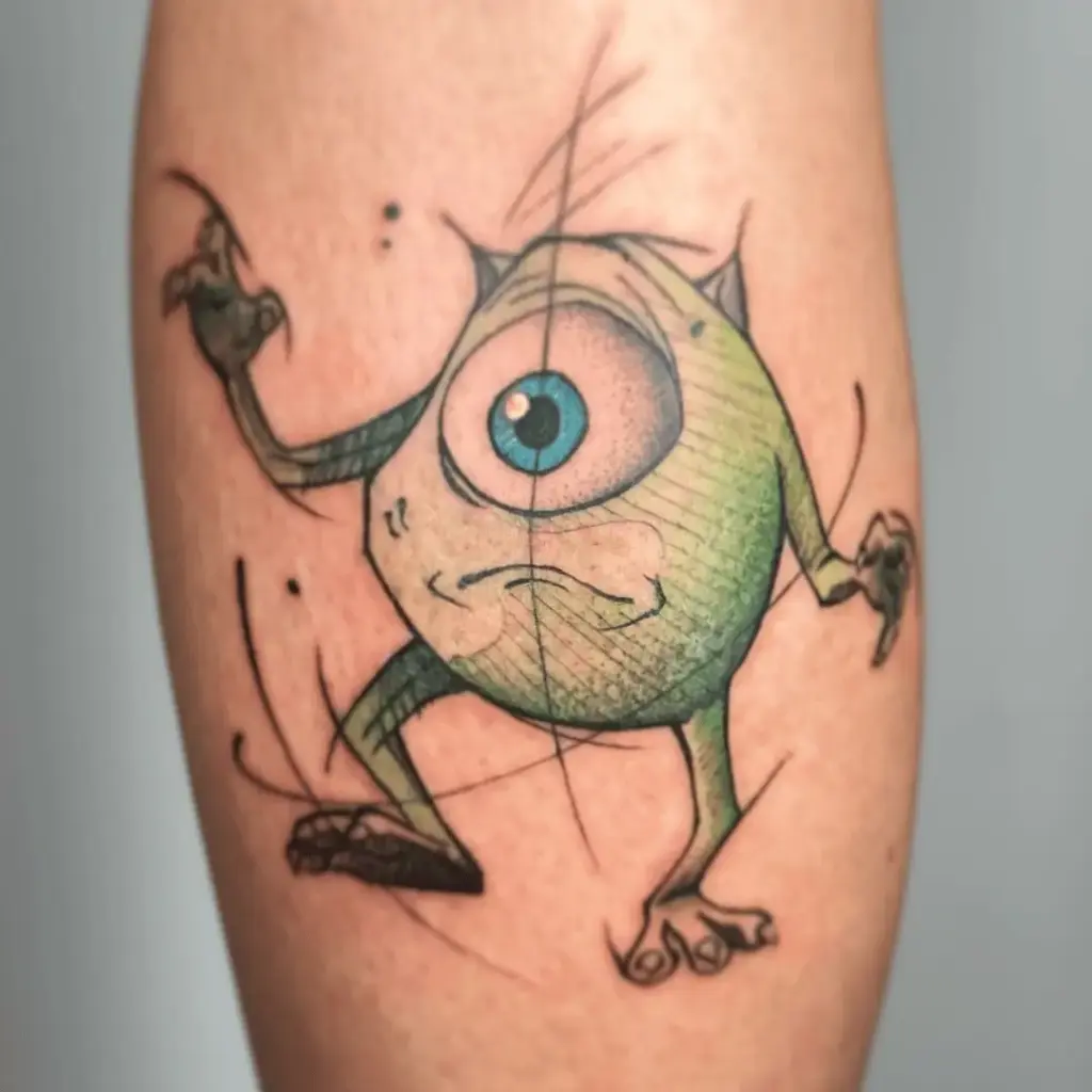 Bright green Mike Wazowski tattoo on the lower leg