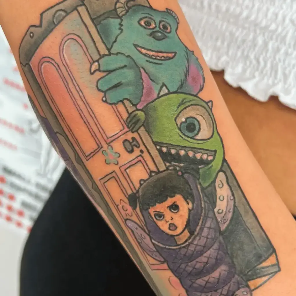 Mike Wazowski included in a colorful Monsters Inc tattoo sleeve