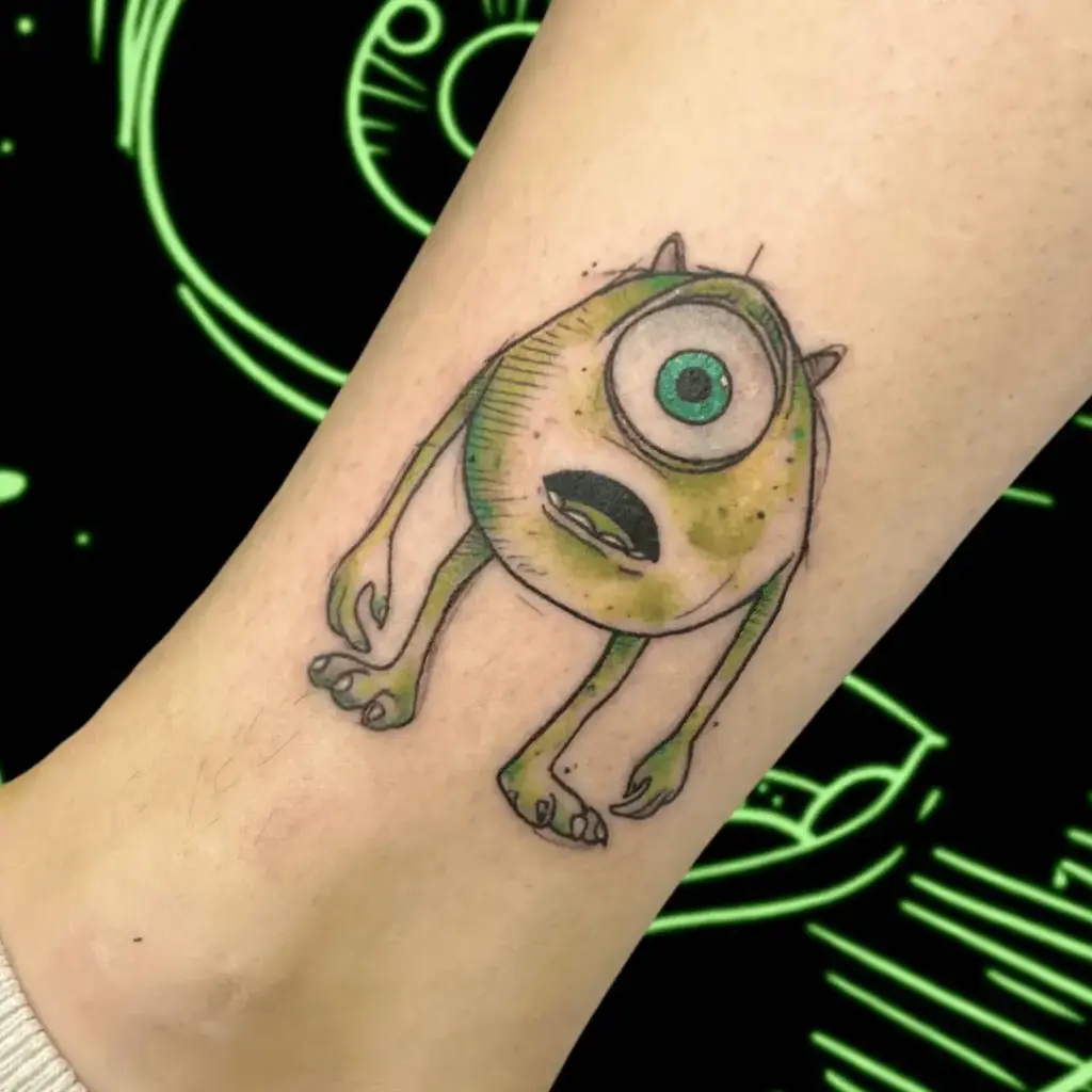 Small Mike Wazowski tattoo positioned above the ankle