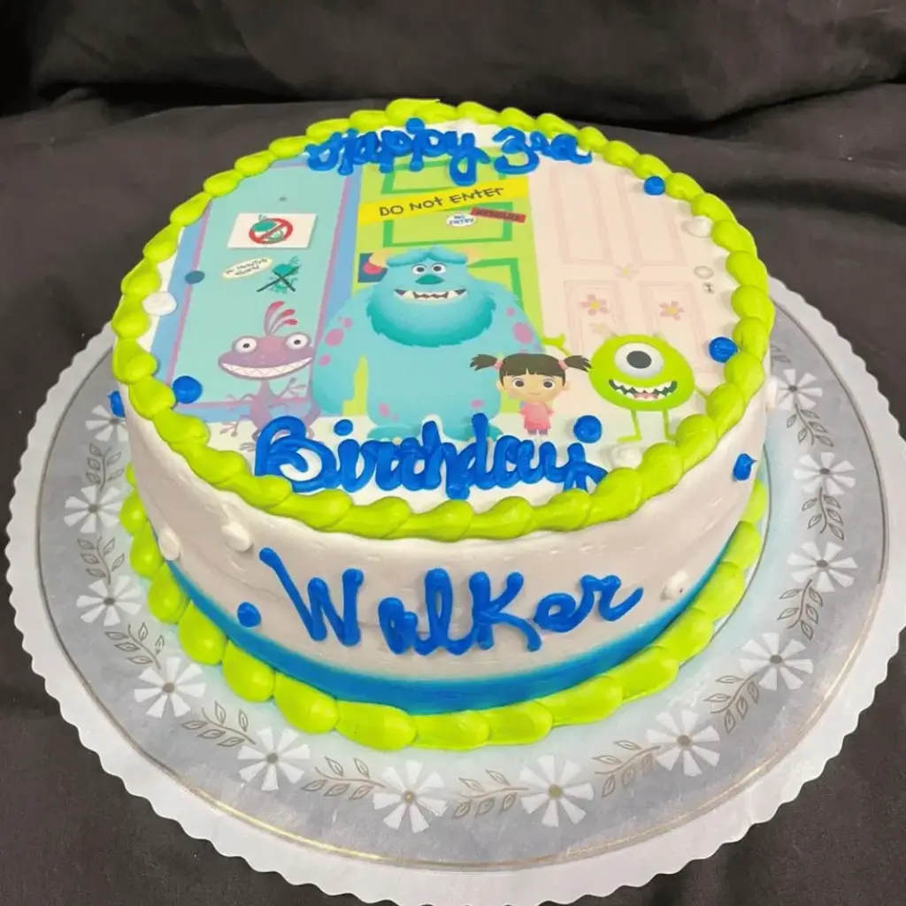 Monsters Inc edible photo cake featuring Mike Wazowski, Sulley and Boo