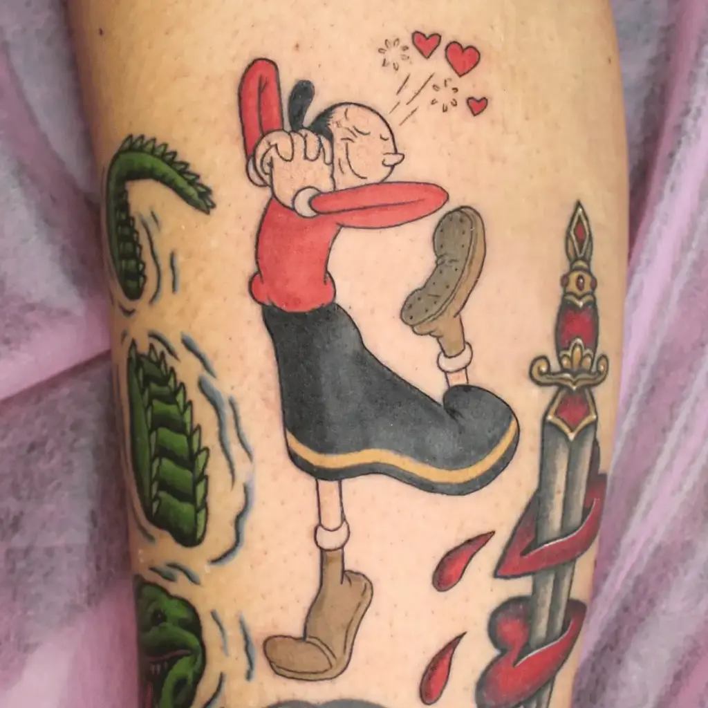 Colorful Olive Oyl character tattoo on the lower leg
