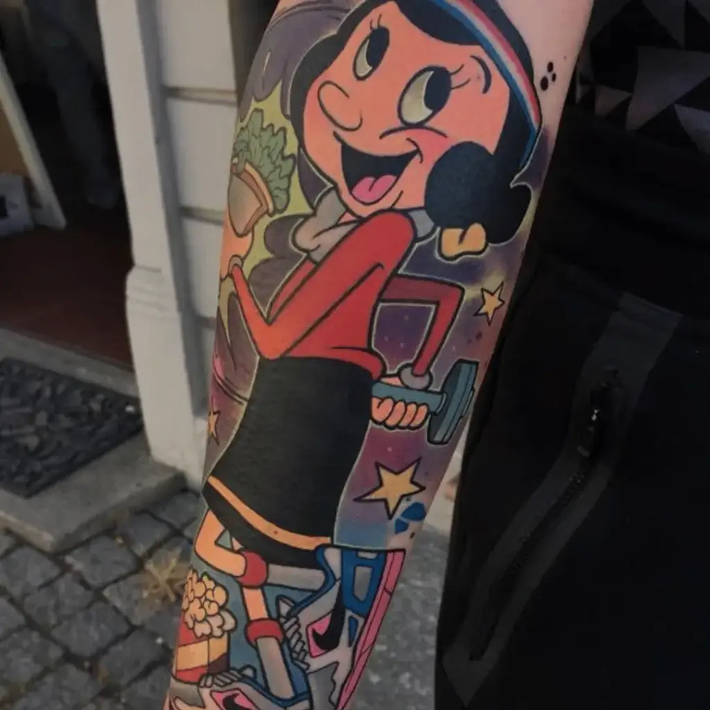 Olive Oyl portrait included in a colorful cartoon tattoo sleeve