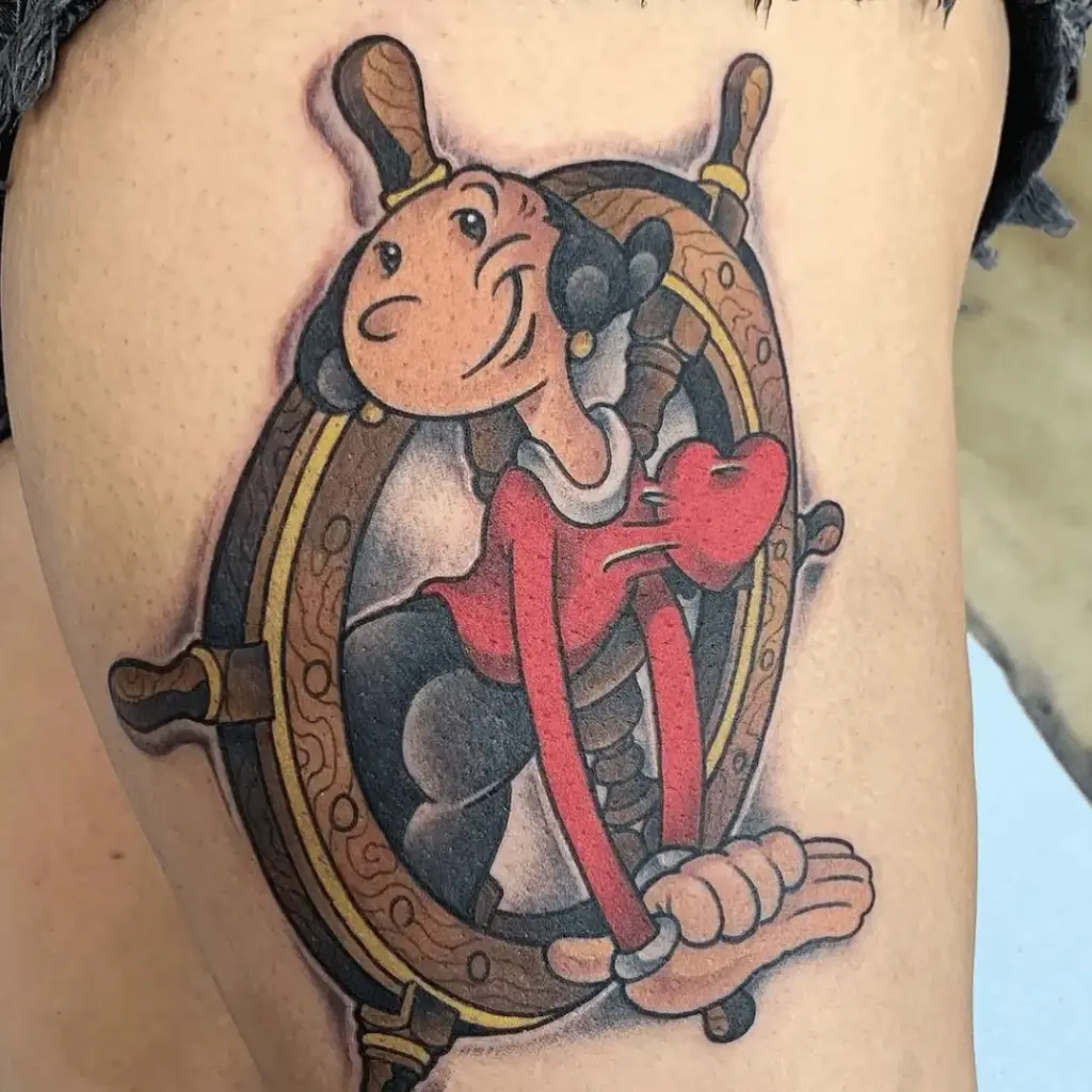 Olive Oyl tattoo positioned on the thigh