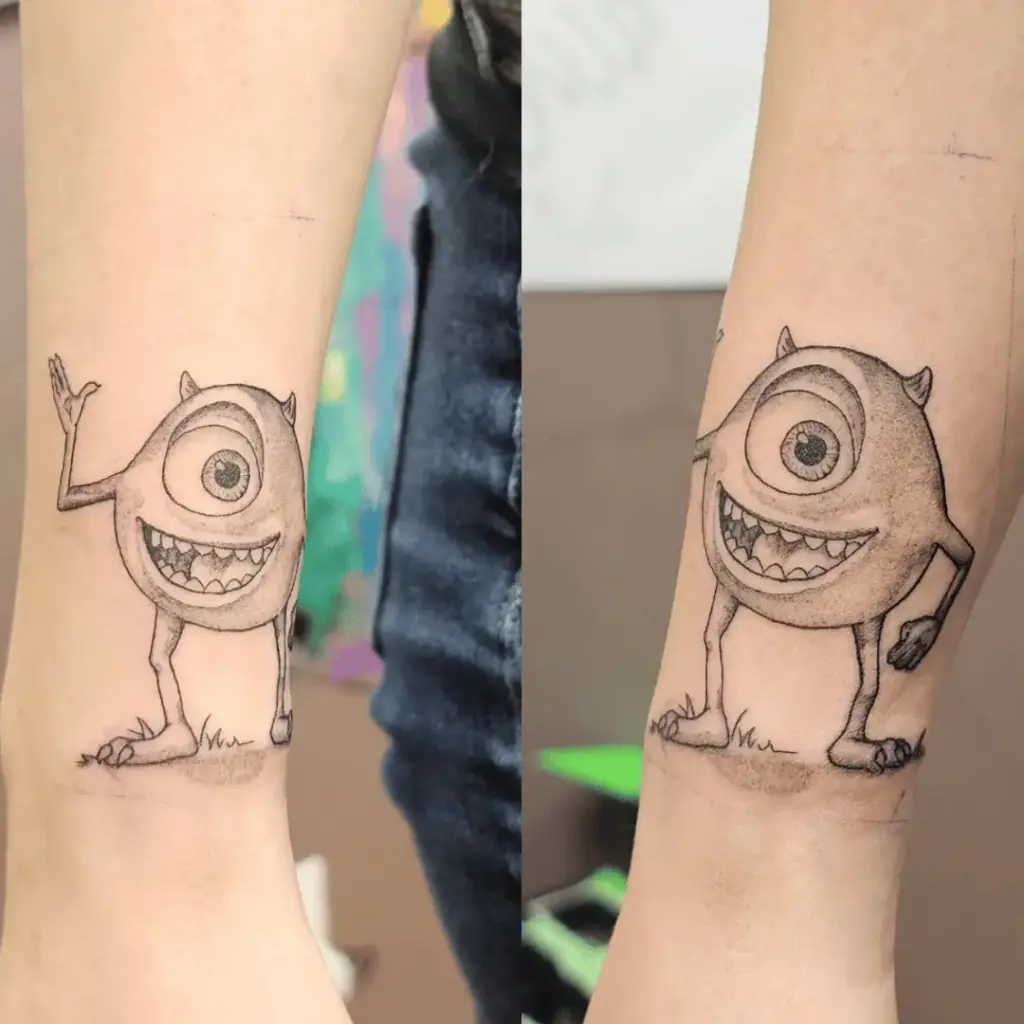 Small Mike Wazowski character tattoo with bright green coloring